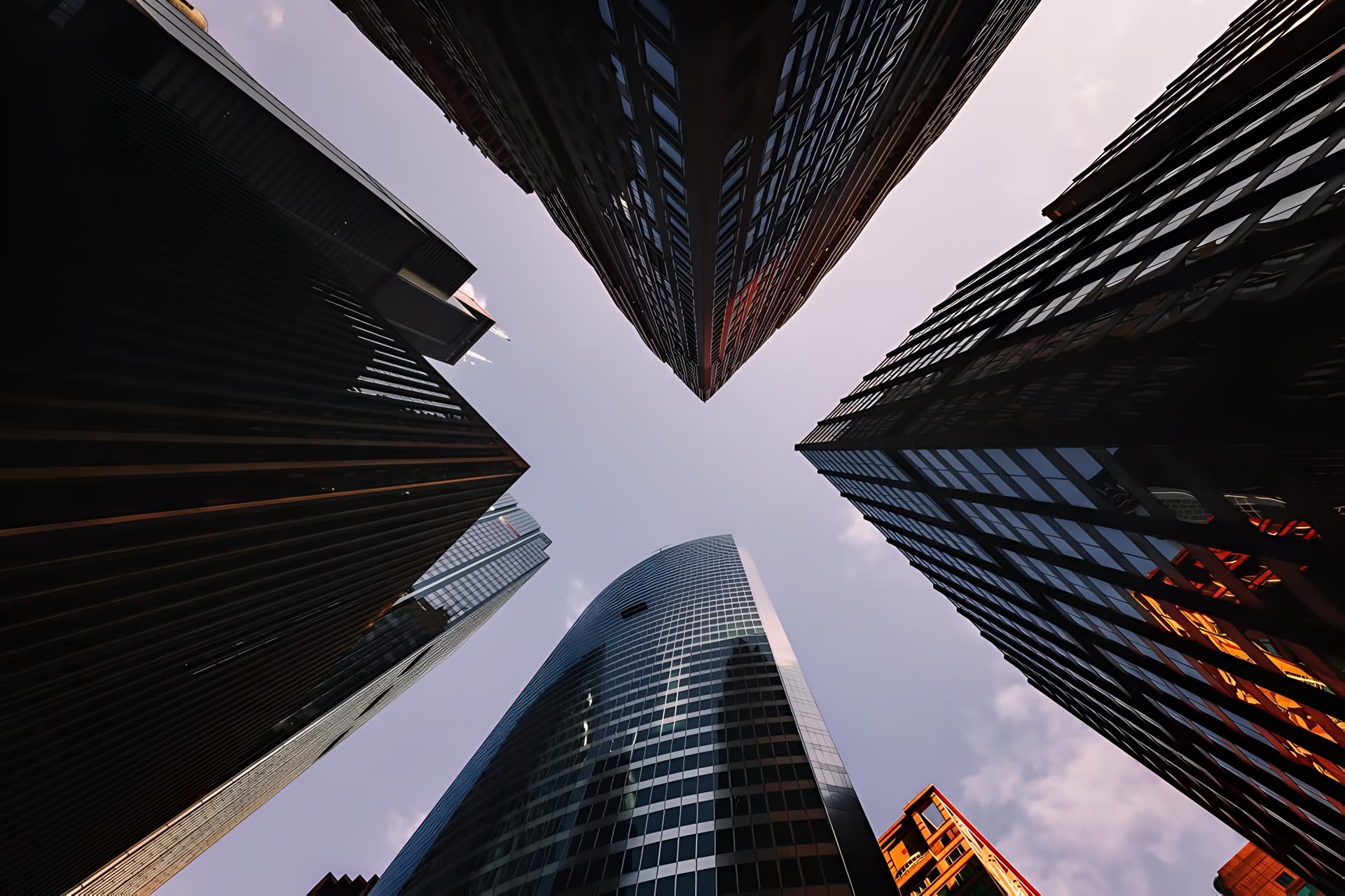 Looking up between tall office towers
